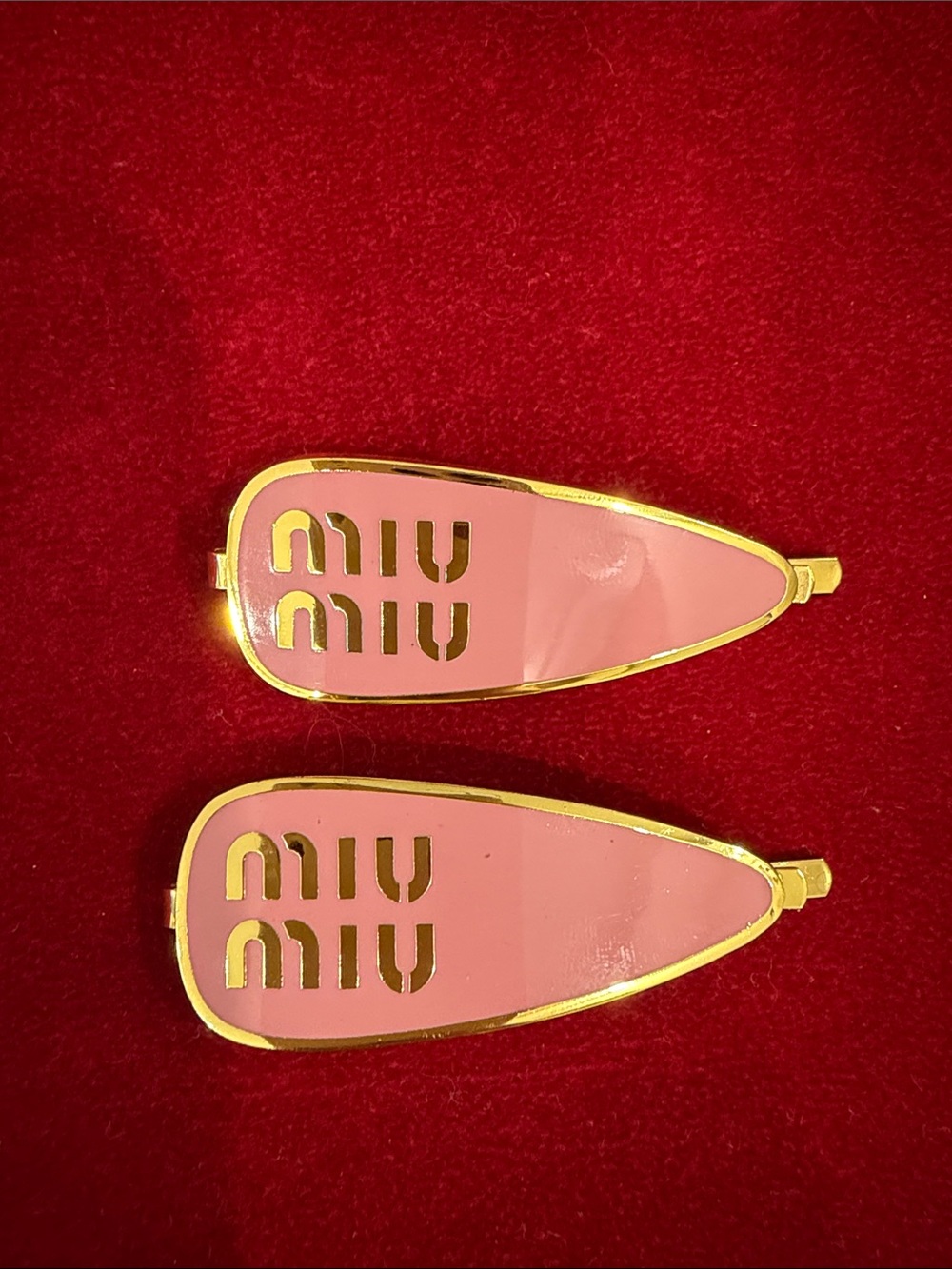 Pair of Pink and Gold Logo Hair Clips